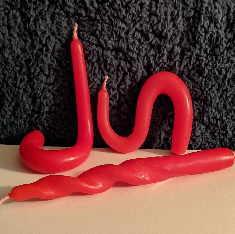 3 red bendy candles